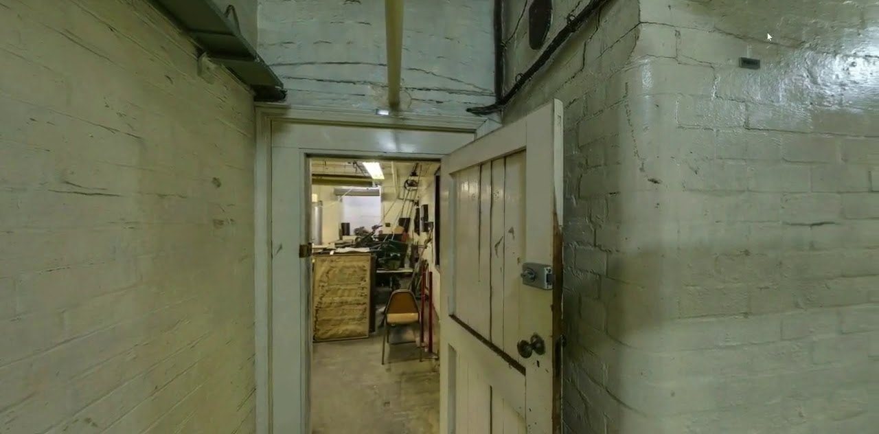 A basement corridor of the Eastern Hill fire station leading to a workroom