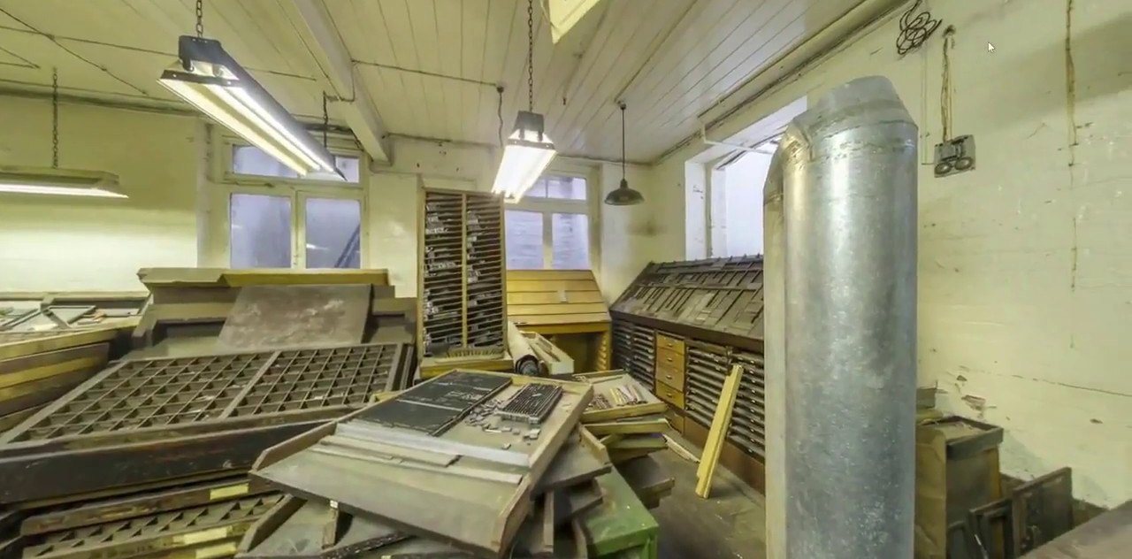 The print room, with wooden type cases and printing equipment